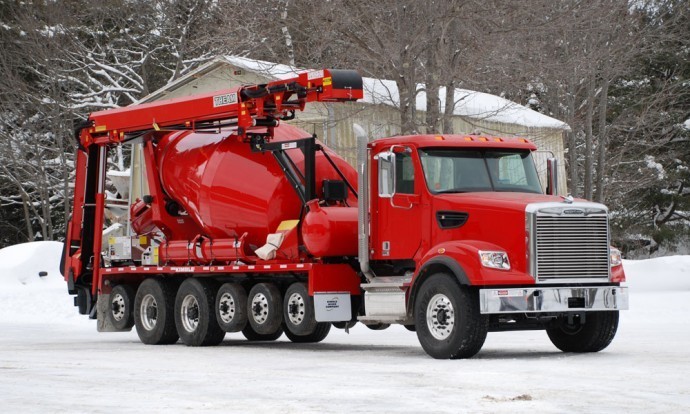 A red truck with a concrete mixer.