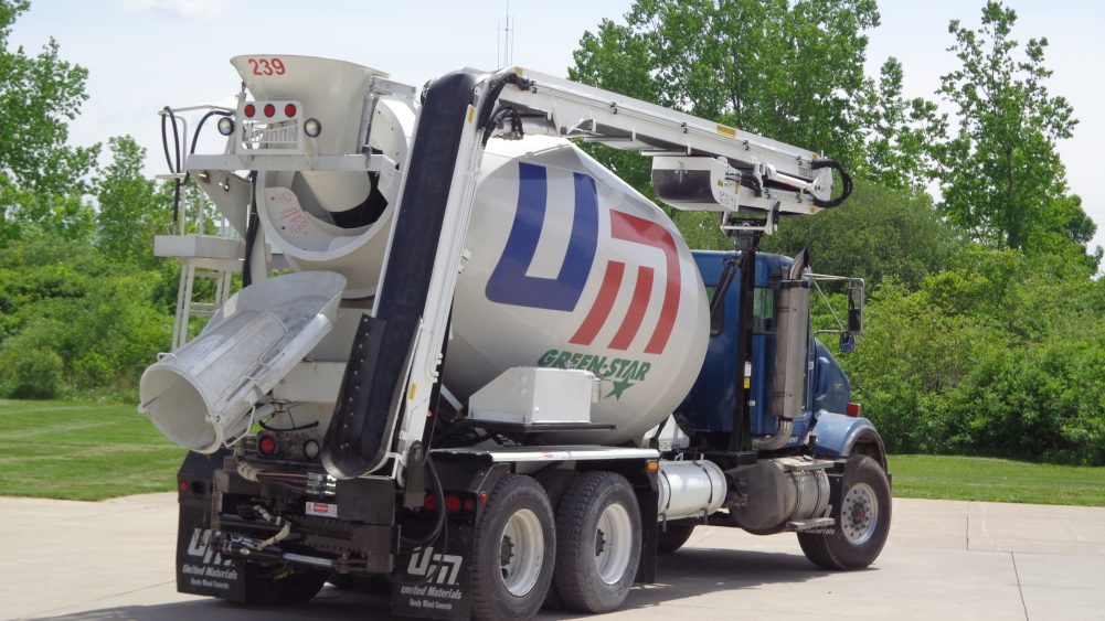 A cement truck with a mixer attached to it.