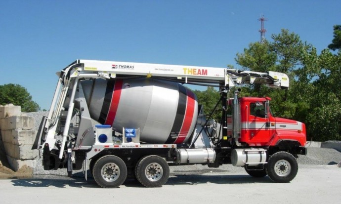 A large truck with a concrete mixer attached to it.