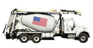 A cement truck with an american flag on it.