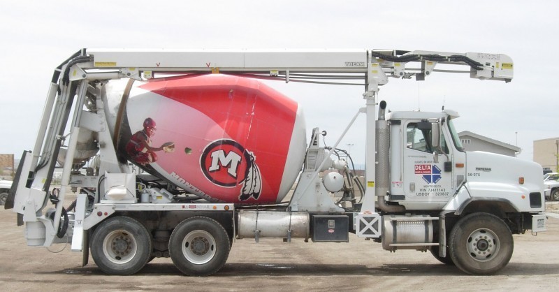A truck with a large concrete mixer on it.